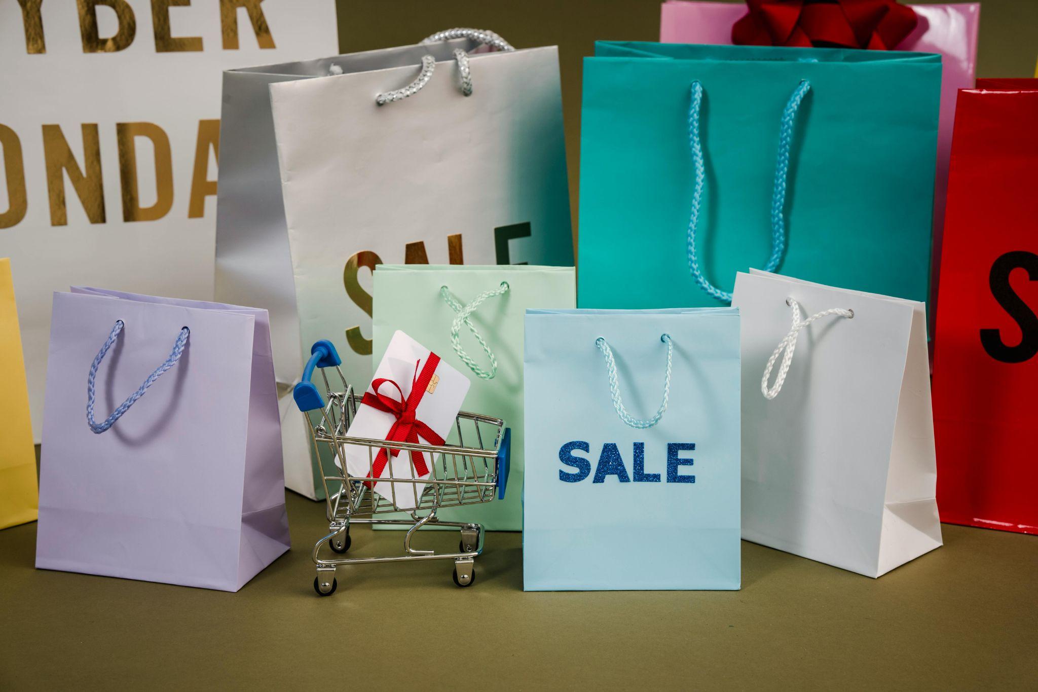 Colorful gift bags with the word "Sale" on them.