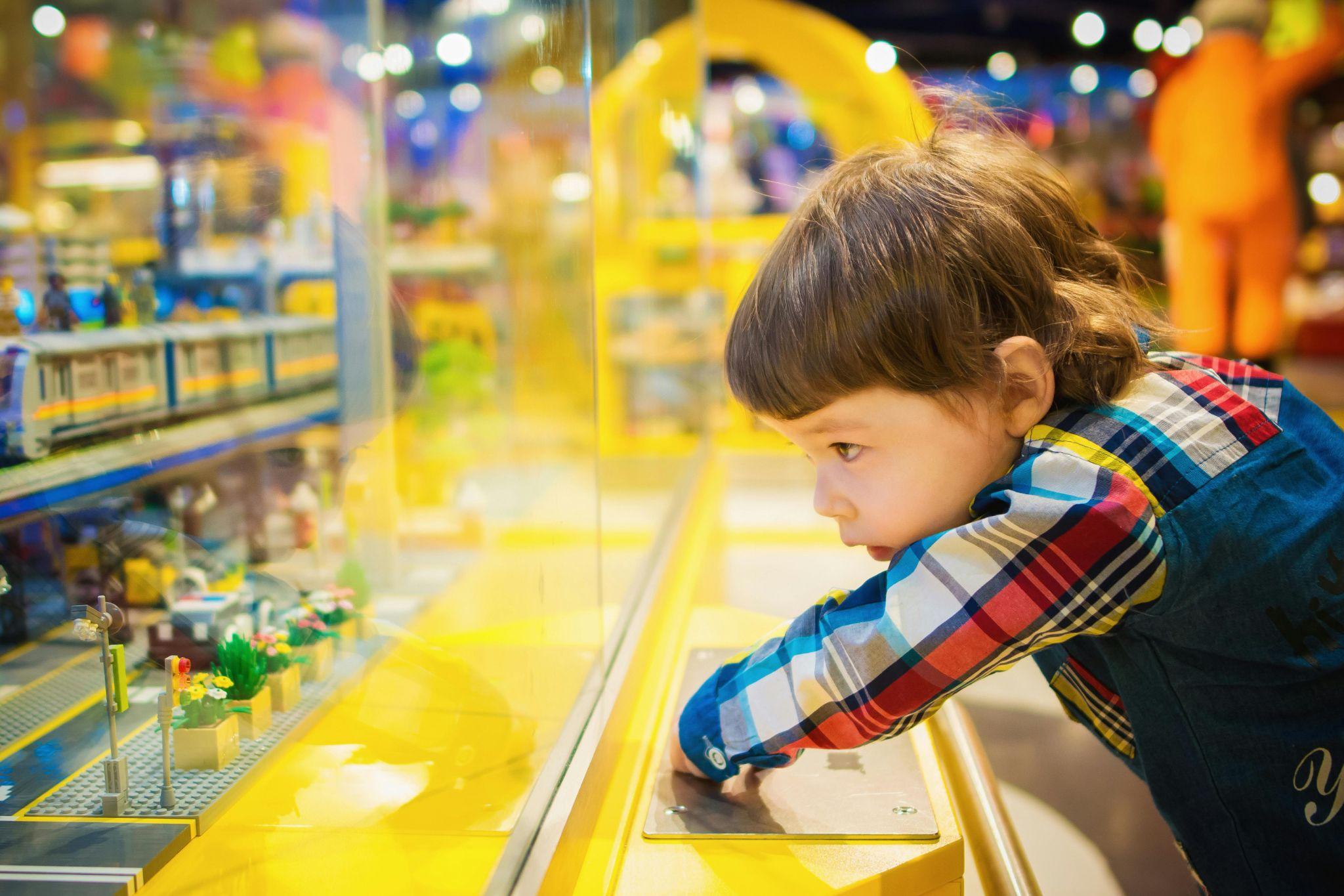 Kid looking at toy display.